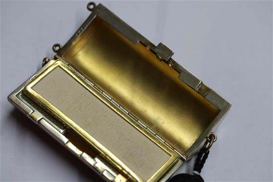 A ladys 1920s silver gilt and gilded red enamelled ovoid minaudiere, import marks for Cohen & Charles, London, 1925, 82mm.